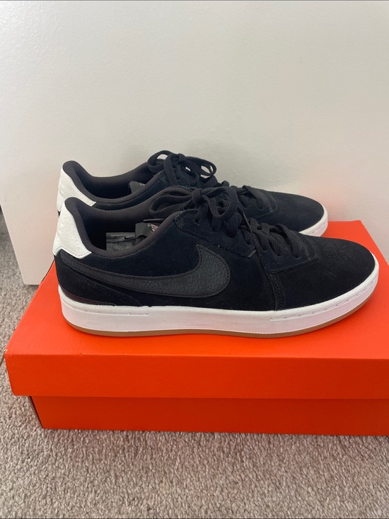 Nike Shoes - Nike Black and White Suede Low-Top Sneakers